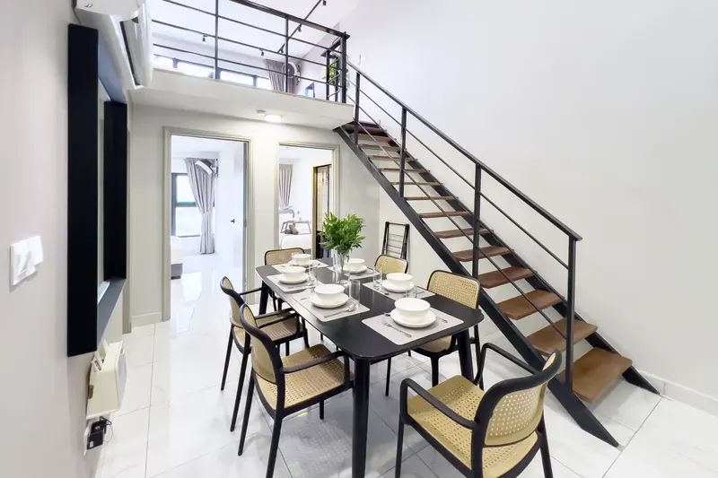 Dining and staircase in an Arte Cheras loft unit managed by WefieHome