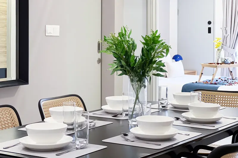 Dining table set for guests in an Arte Cheras unit