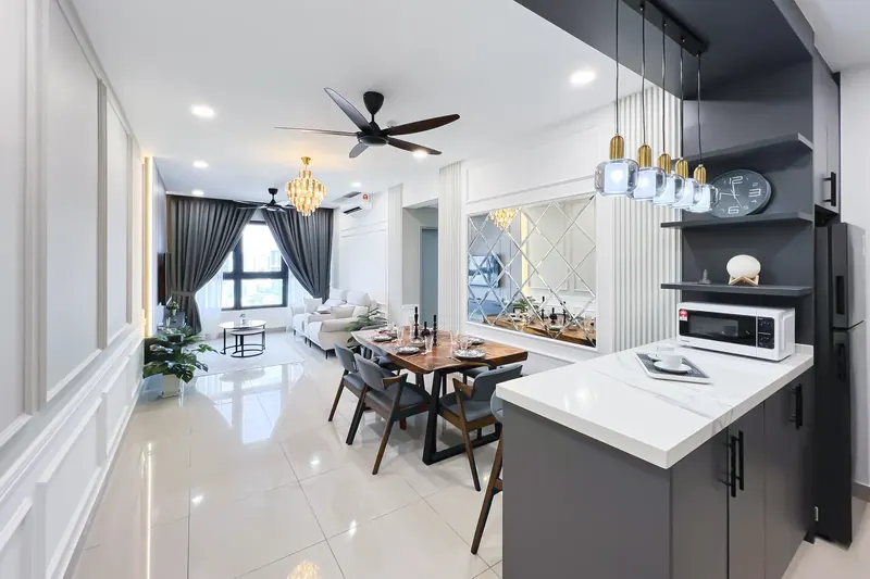 Renovated open-plan kitchen and dining area in an M Vertica unit managed by WefieHome