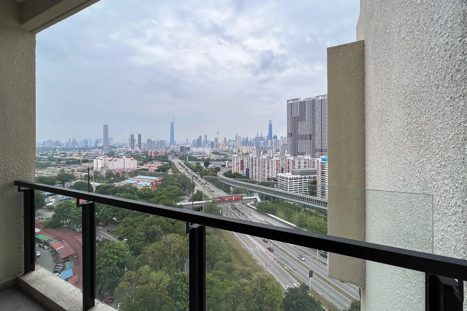 Kuala Lumpur city skyline seen from the balcony of a WefieHome-managed condo
