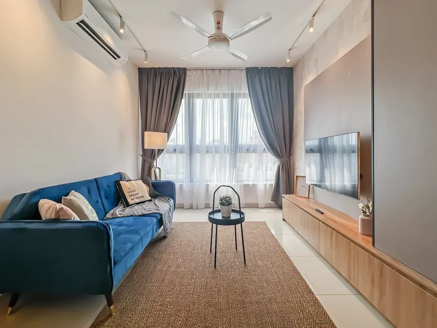 Living room with a blue velvet sofa in a condo managed by WefieHome