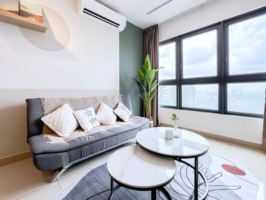 Sage-green living room with large windows in a condo managed by WefieHome