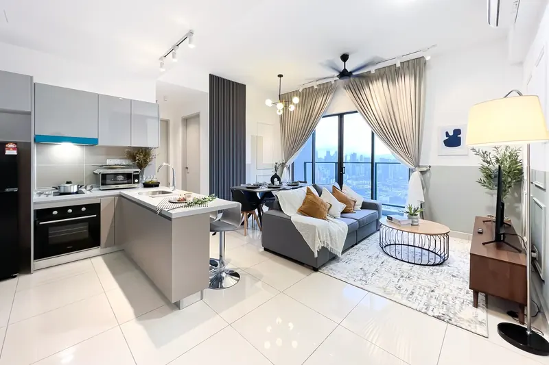 Open-plan living, dining and kitchen in the 3-bedroom Trion KL unit furnished by WefieHome